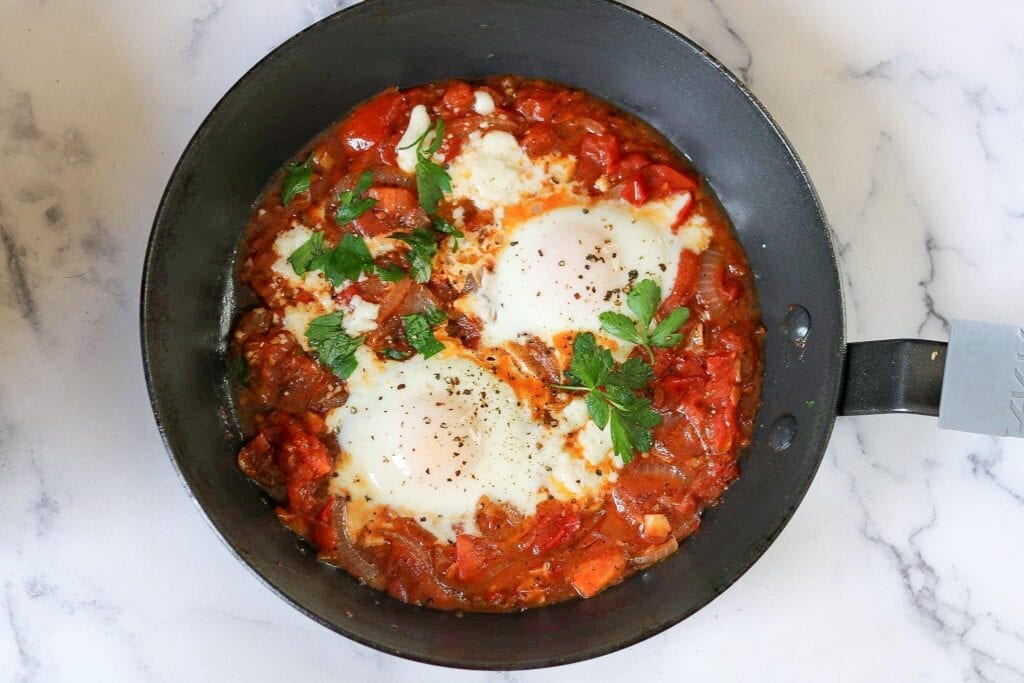 delicious shakshuka or eggs in tomatoes. – A cook named Rebecca