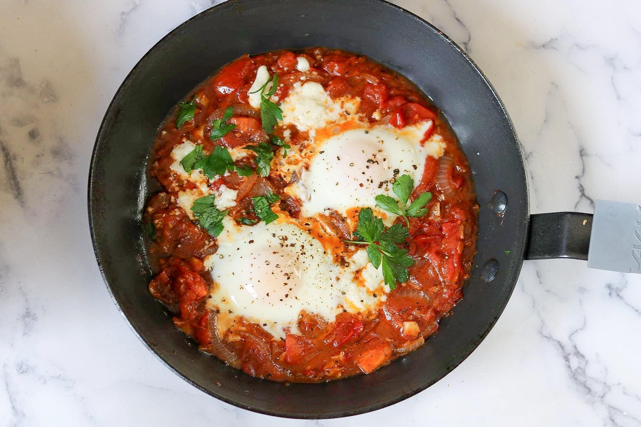 delicious shakshuka or eggs in tomatoes. – The 2 Spoons